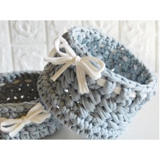 Gray round crochet cotton basket with white bow